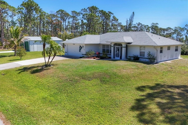 ranch-style home featuring a front lawn, concrete driveway, an attached garage, and stucco siding