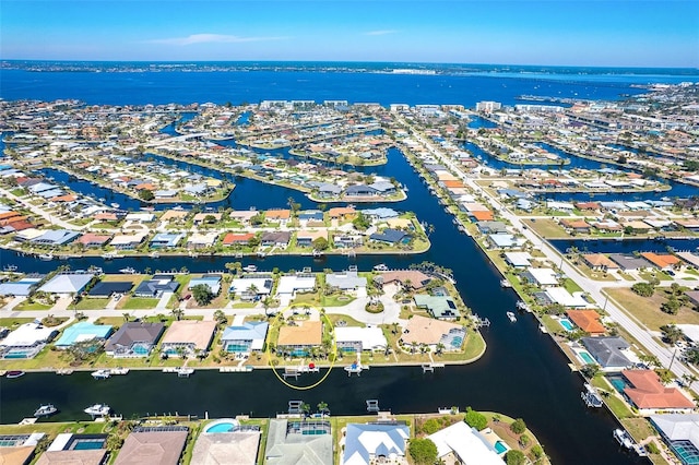 aerial view with a water view and a residential view