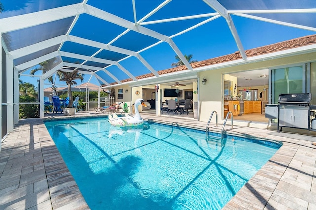 471 Capri Isles Ct, Punta Gorda, FL 33950 - outdoor pool featuring a lanai, a ceiling fan, area for grilling, and a patio