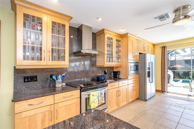 471 Capri Isles Ct, Punta Gorda, FL 33950 - kitchen with light brown cabinets, wall chimney exhaust hood, appliances with stainless steel finishes, and visible vents