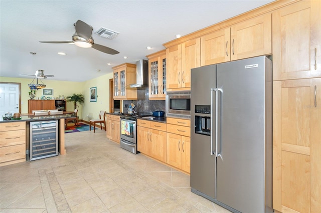 471 Capri Isles Ct, Punta Gorda, FL 33950 - kitchen with light brown cabinets, wall chimney exhaust hood, stainless steel appliances, and wine cooler