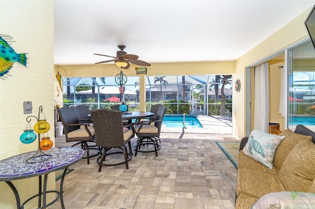471 Capri Isles Ct, Punta Gorda, FL 33950 - sunroom with ceiling fan, a pool, and plenty of natural light