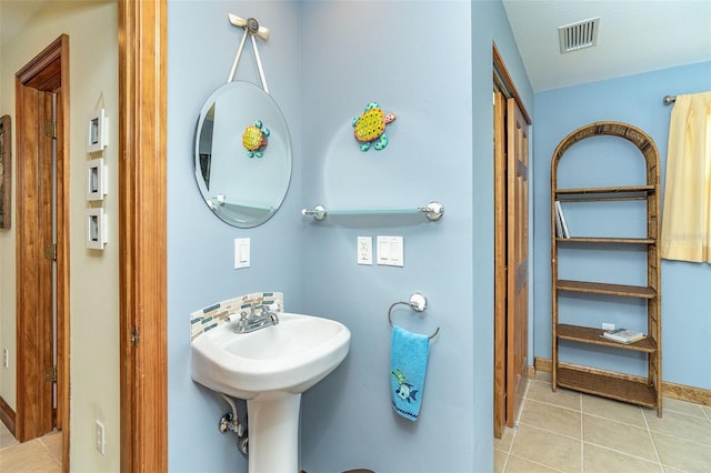 471 Capri Isles Ct, Punta Gorda, FL 33950 - bathroom featuring visible vents, tile patterned flooring, and baseboards