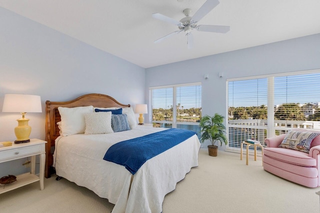 carpeted bedroom featuring a ceiling fan