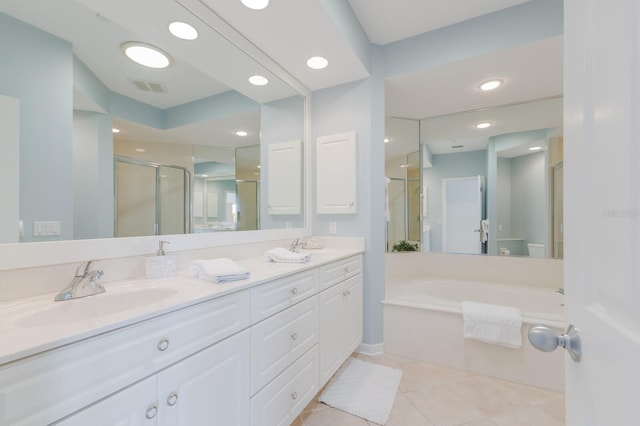 full bathroom with a sink, visible vents, a stall shower, and double vanity