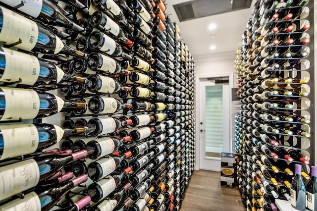 wine cellar featuring visible vents and wood finished floors