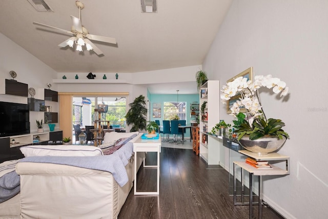 bedroom with visible vents, baseboards, and wood finished floors