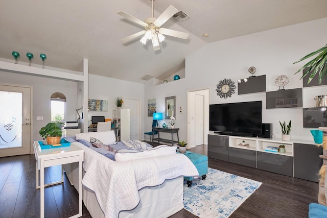 living area with visible vents, high vaulted ceiling, wood finished floors, arched walkways, and ceiling fan