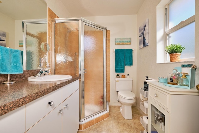 bathroom with toilet, a stall shower, vanity, and tile patterned flooring