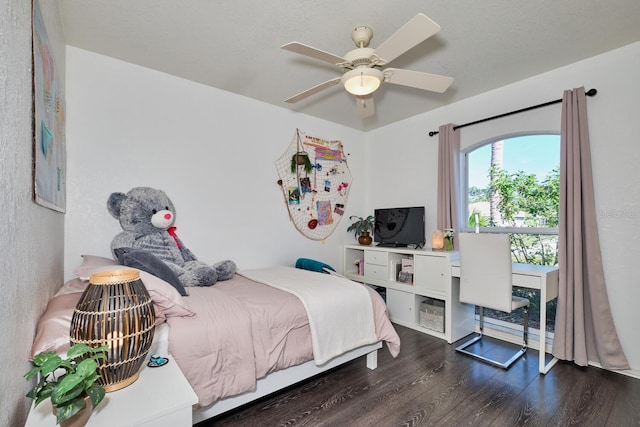 bedroom with dark wood-type flooring and ceiling fan