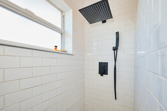 full bathroom with a tile shower