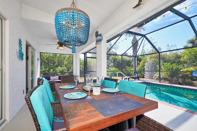 sunroom / solarium with an inviting chandelier