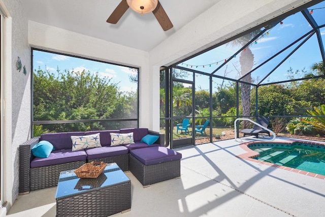 sunroom with a ceiling fan