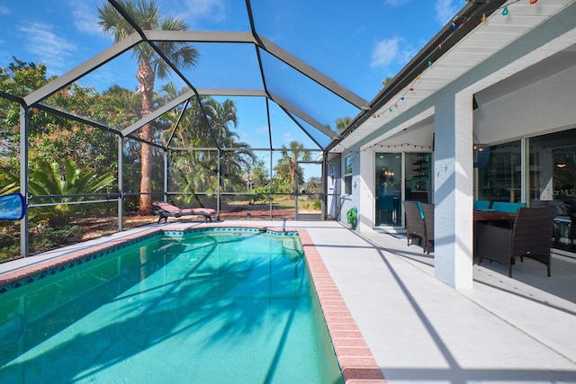 pool with a patio and a lanai