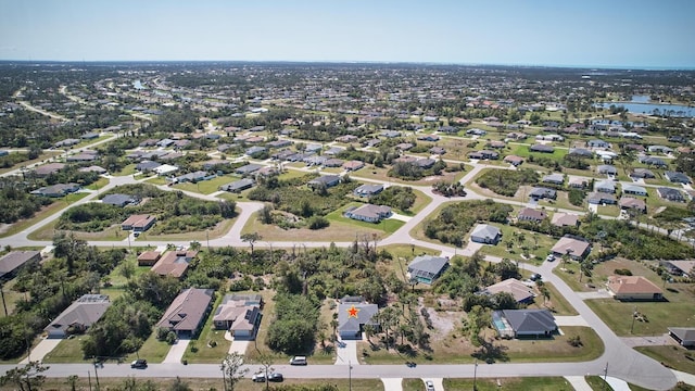 bird's eye view with a residential view and a water view