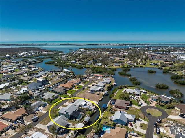 aerial view featuring a water view and a residential view