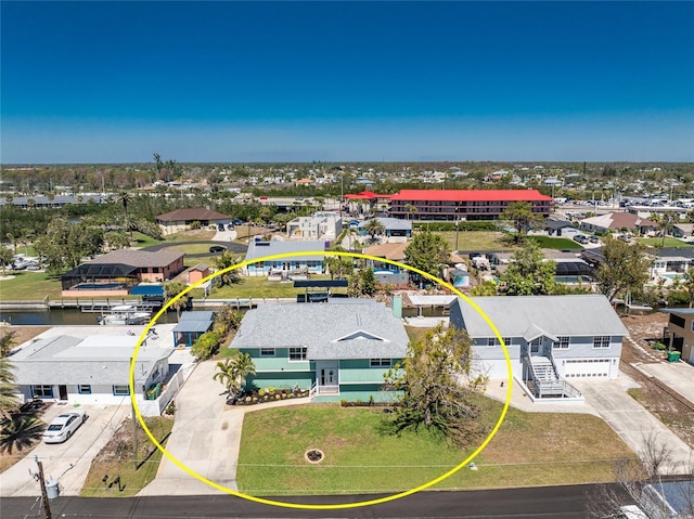 birds eye view of property with a residential view