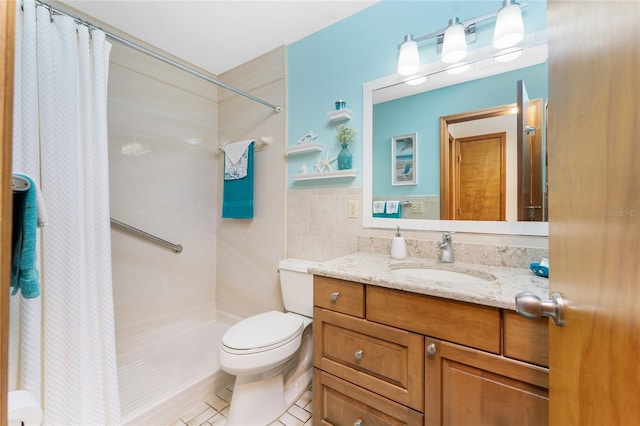 full bath with tile patterned flooring, curtained shower, toilet, vanity, and tile walls