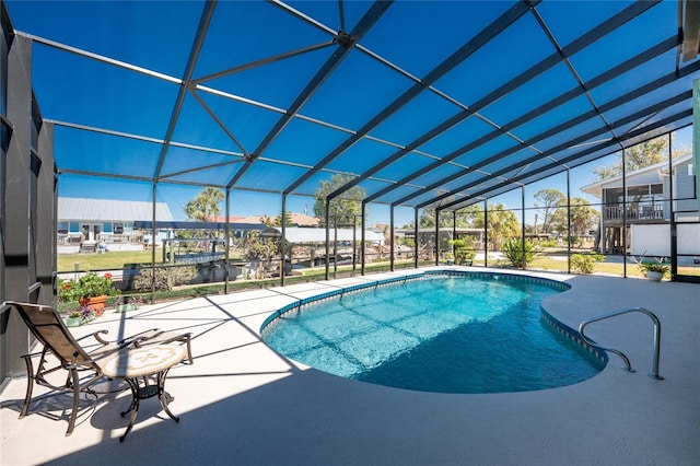 outdoor pool with a patio and a lanai