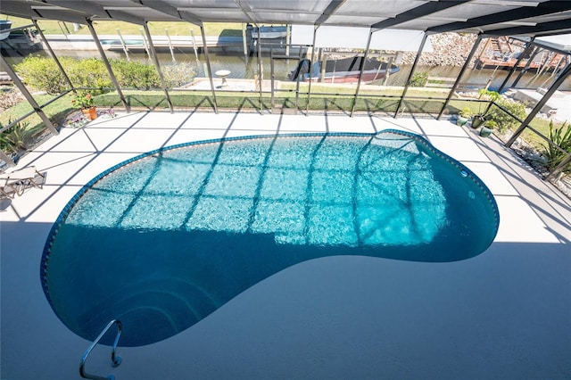 pool with a patio and a lanai