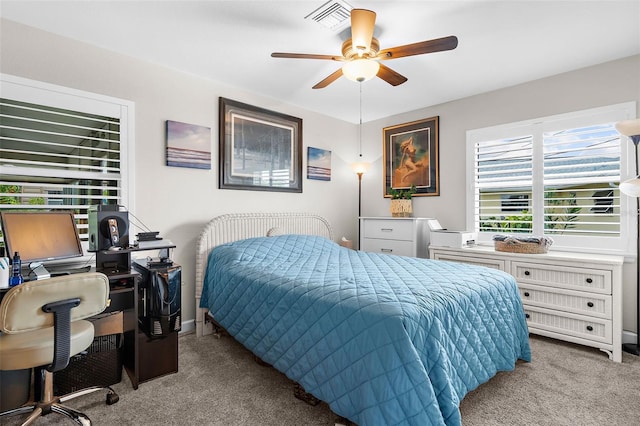 bedroom featuring visible vents, ceiling fan, and carpet