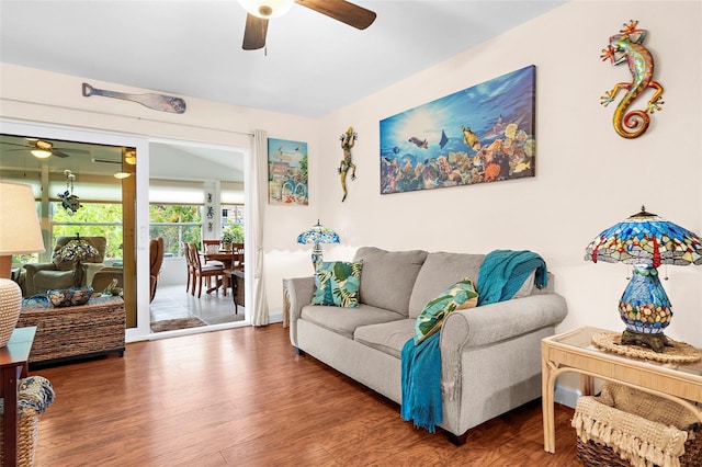 living room featuring a ceiling fan and wood finished floors