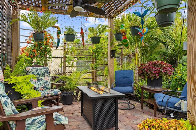 view of patio with a pergola, an outdoor fire pit, a ceiling fan, and fence