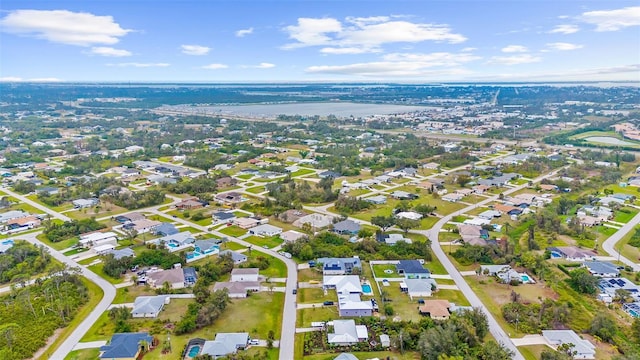 aerial view with a water view and a residential view