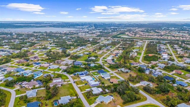 drone / aerial view with a residential view and a water view