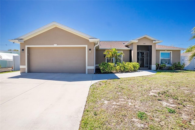 ranch-style house with concrete driveway, an attached garage, a front yard, and stucco siding