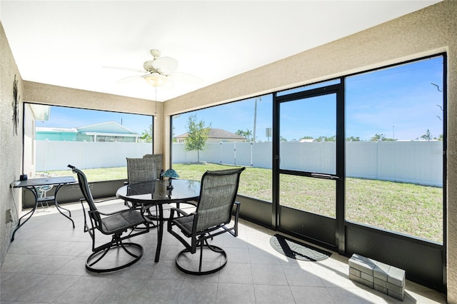 sunroom with a ceiling fan