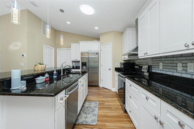 kitchen featuring light wood finished floors, tasteful backsplash, white cabinets, stainless steel appliances, and a sink