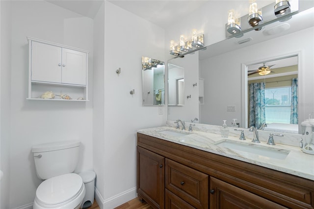 full bath with a sink, visible vents, baseboards, and toilet