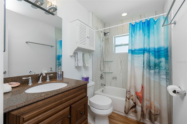 bathroom featuring wood finished floors, toilet, vanity, and shower / bathtub combination with curtain