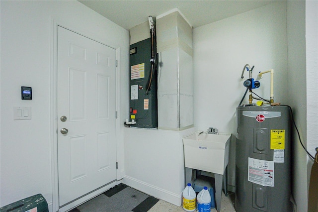 utilities with water heater and a sink