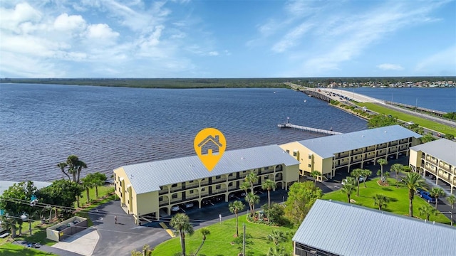 birds eye view of property with a water view