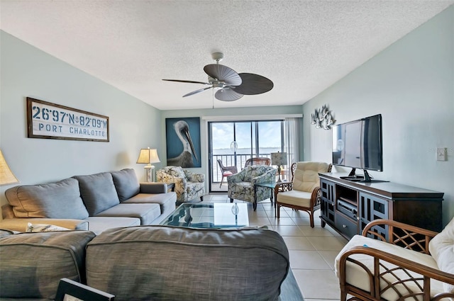 living area with light tile patterned flooring, a textured ceiling, and ceiling fan