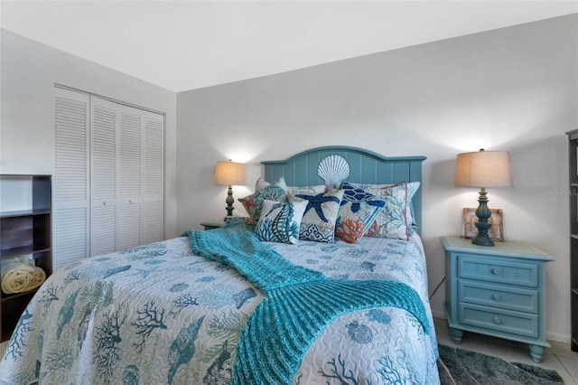 tiled bedroom with a closet