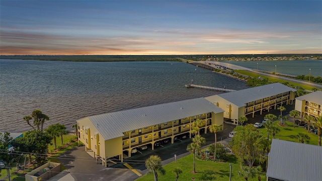 aerial view at dusk with a water view