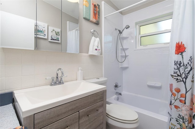 bathroom with tile walls, toilet, vanity, and shower / bathtub combination with curtain