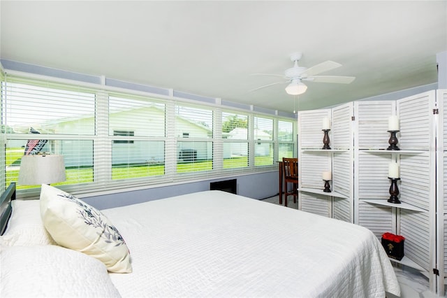 bedroom featuring a sunroom and ceiling fan