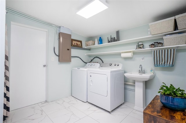 clothes washing area featuring electric panel, laundry area, independent washer and dryer, and marble finish floor