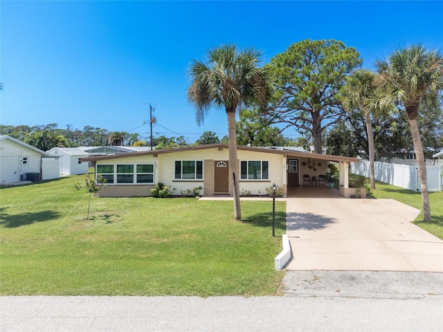 single story home with a carport, fence, a front yard, and driveway