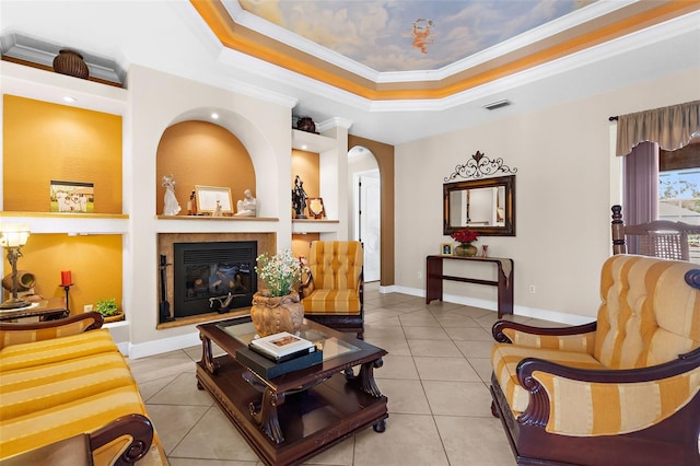 living area featuring tile patterned flooring, a raised ceiling, crown molding, and arched walkways