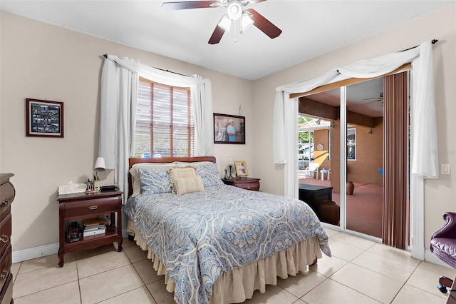 bedroom featuring ceiling fan, baseboards, access to exterior, and tile patterned flooring