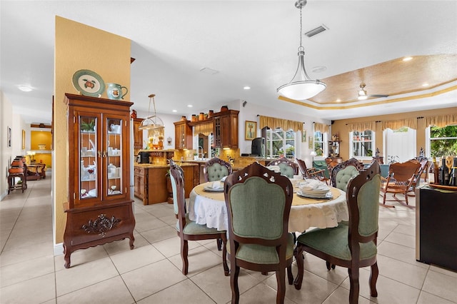 dining room with visible vents, light tile patterned flooring, recessed lighting, ceiling fan, and a raised ceiling