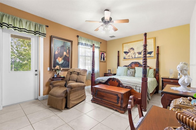 bedroom with light tile patterned floors, visible vents, multiple windows, and ceiling fan