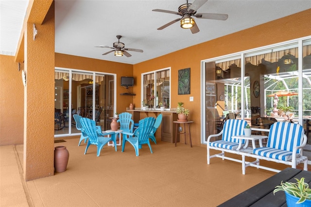 view of patio / terrace featuring a lanai and ceiling fan