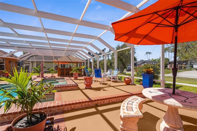 view of patio with glass enclosure