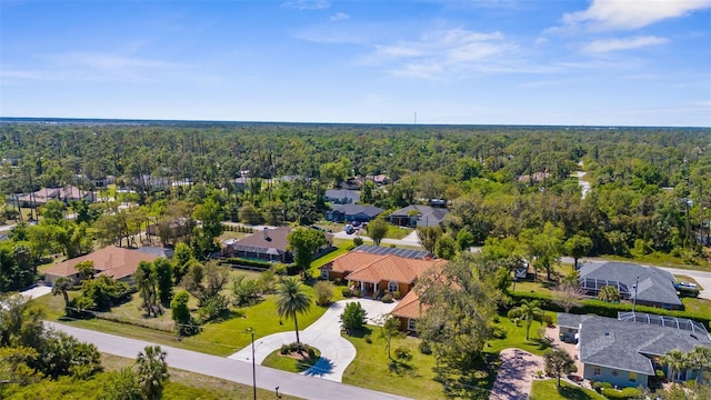 aerial view with a wooded view and a residential view